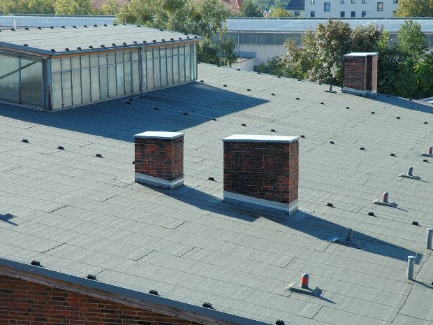 arizona flat roof company applying elastomeric coating